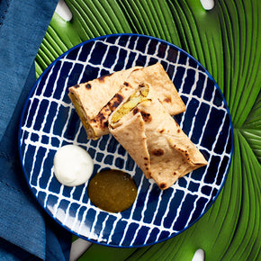 Photograph of Roti Roll with Cauliflower & Potatoes. Served with chutney and plain Yogurt. Mouth Watering!