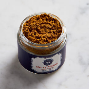 Photograph of Ayurvedic Spice Curry Masala. Mixture of many spices. Color is light brown.